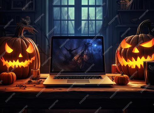 halloween pumpkins displayed table near lit computer 921860 38378